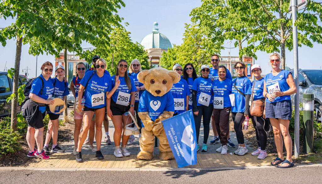 Participants in the Bridgewater Way Walk pose with the Christie bear