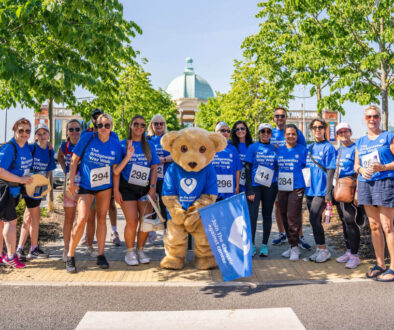 Participants in the Bridgewater Way Walk pose with the Christie bear